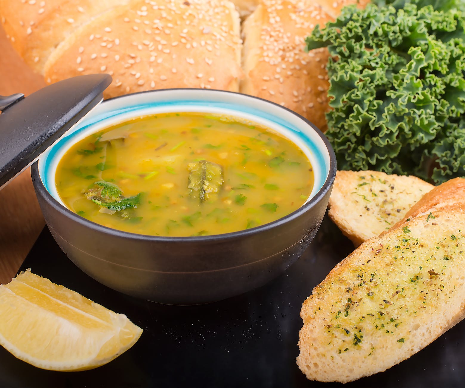 soup in black ceramic bowl