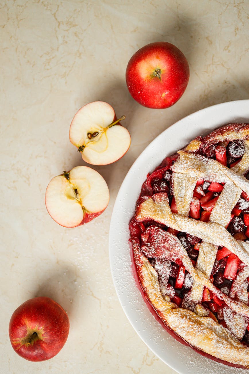 sliced apple beside an apple pie