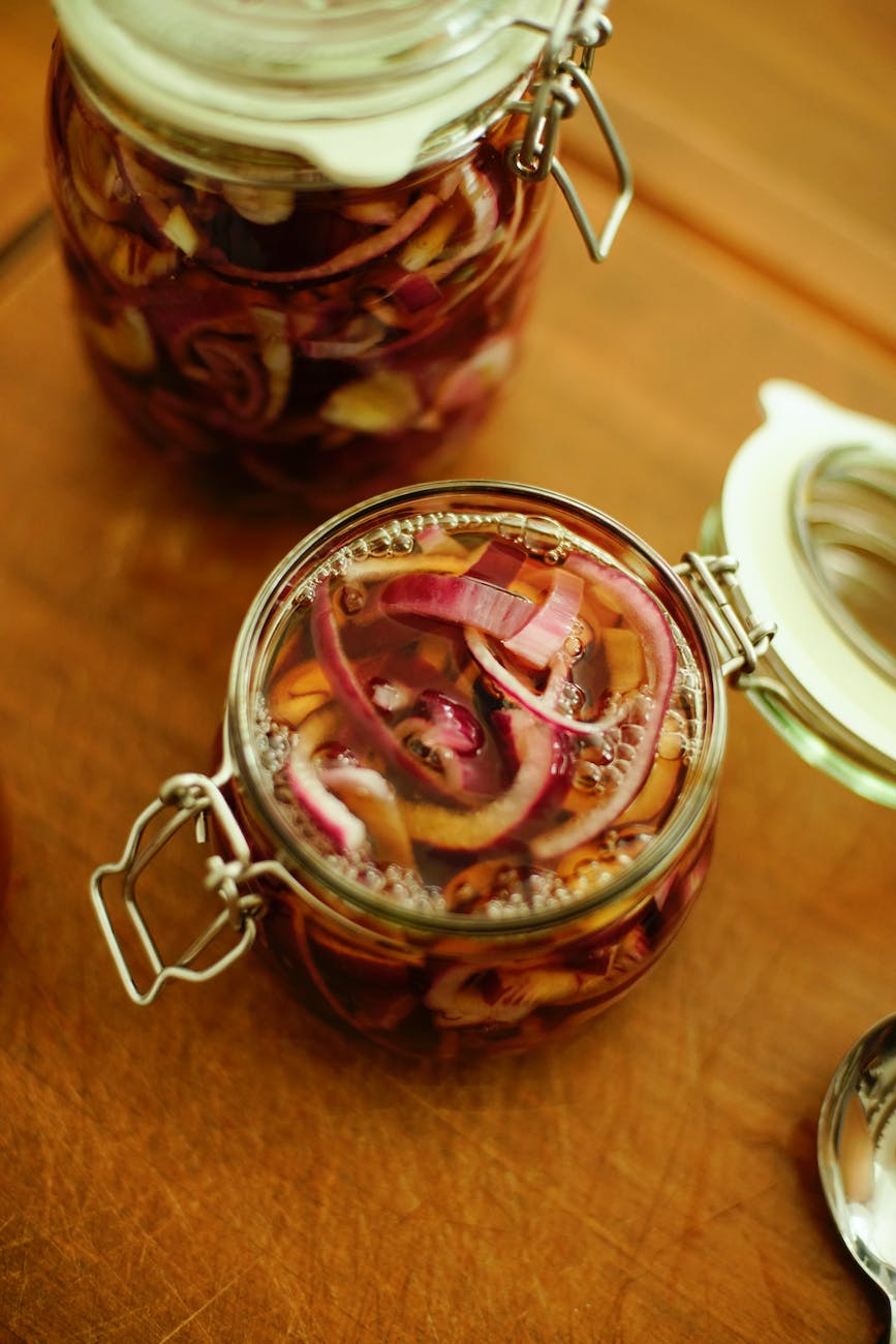 pickled onions in clear glass jar