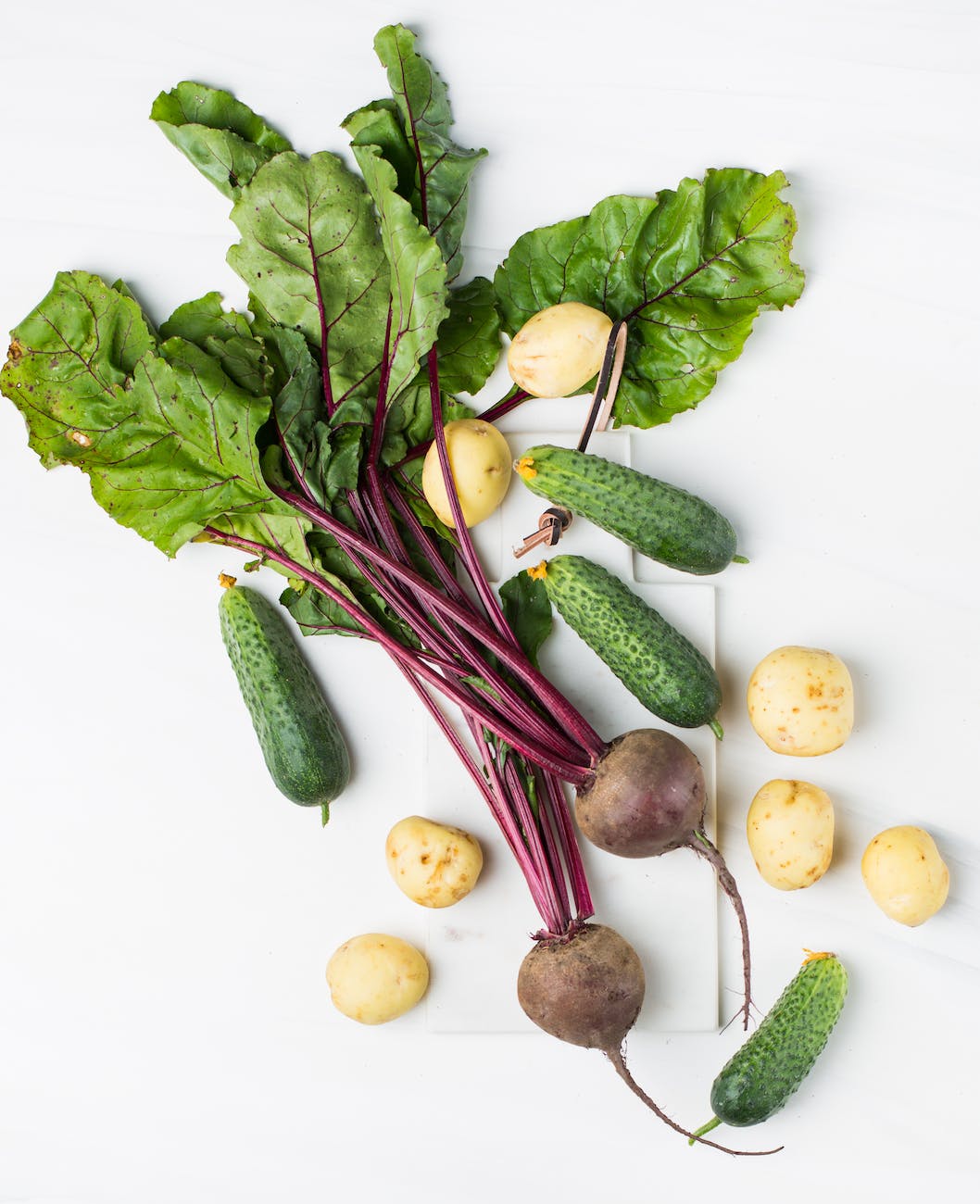 assorted vegetables on white surface